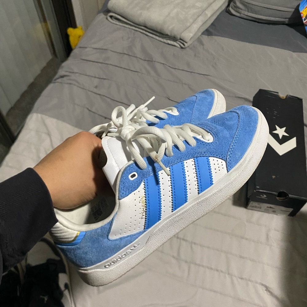 Blue and white Adidas skate shoes